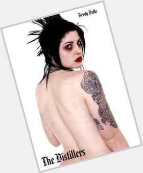 Brody Dalle Average body,  dyed black hair & hairstyles